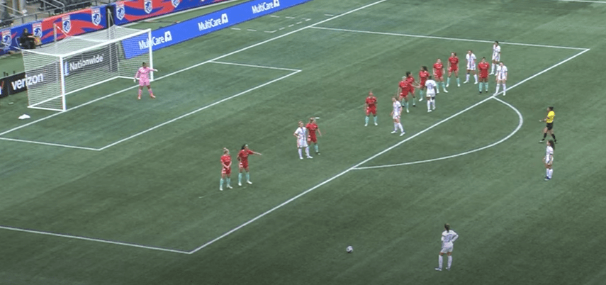 Lauren Barnes of OL Reign taking a wide free kick vs. Kansas City Current.